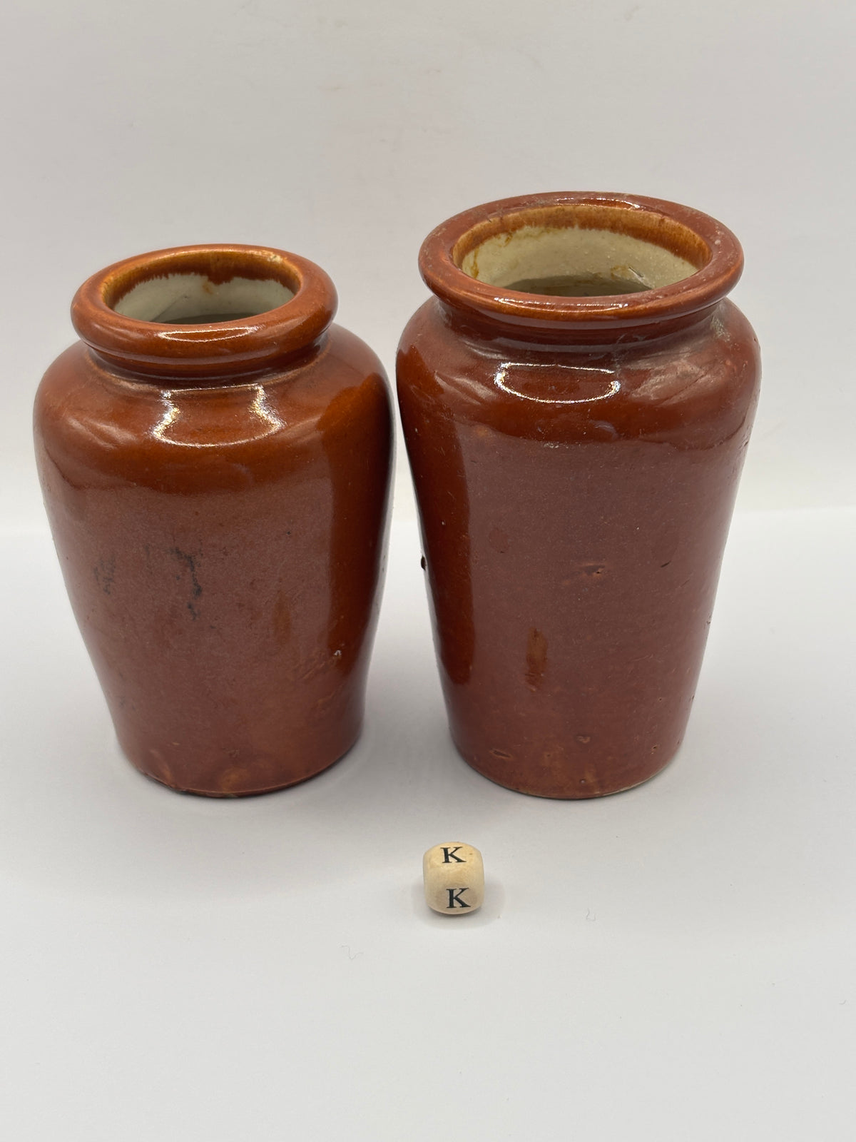 2 Old brown stoneware cream pots (K)