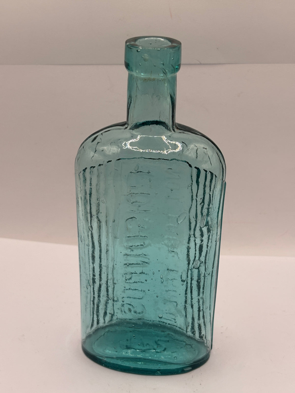 Old aqua glass poison bottle, ammonia, POISONOUS not to be taken