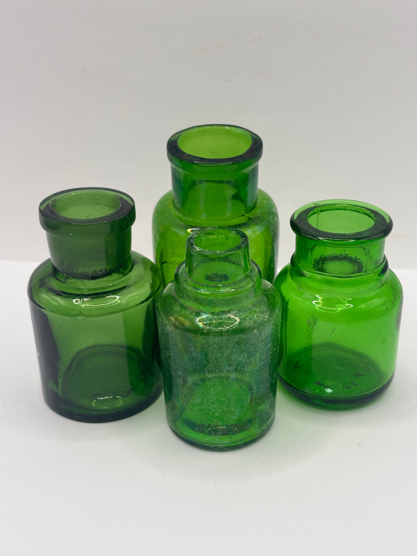 4 old green glass jars