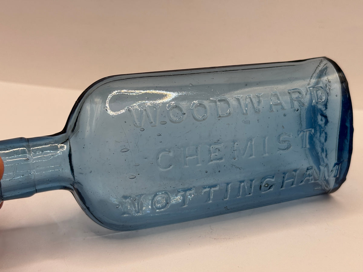 Old blue glass chemist bottle, Woodwards chemist Nottingham