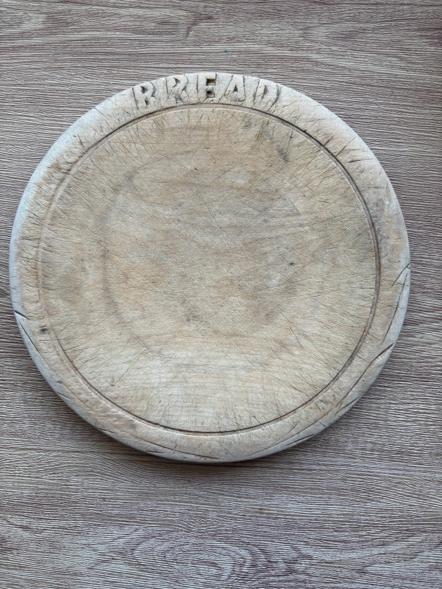 Old wooden carved bread board