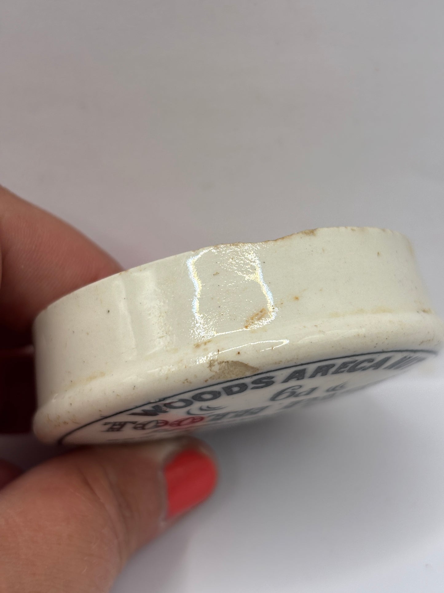 Old advertising lid, Woods areca nut tooth paste