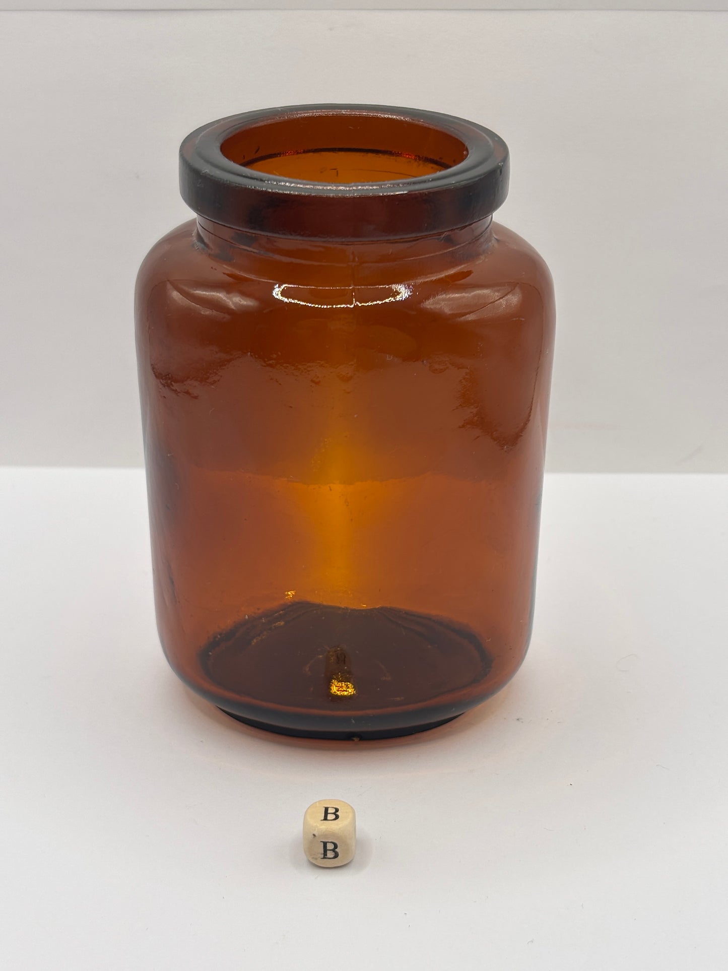 Old amber glass jar (B)