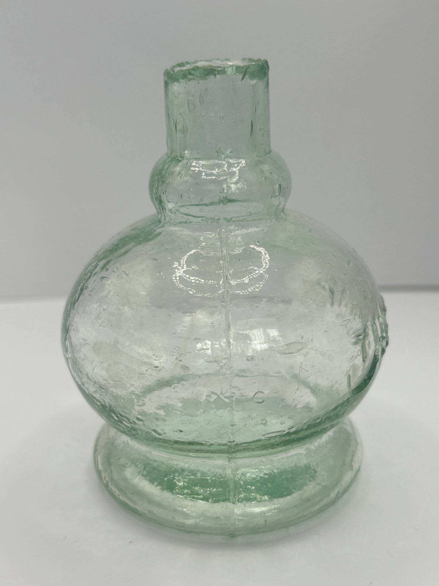 Small aqua glass oil lamp. The Lamp