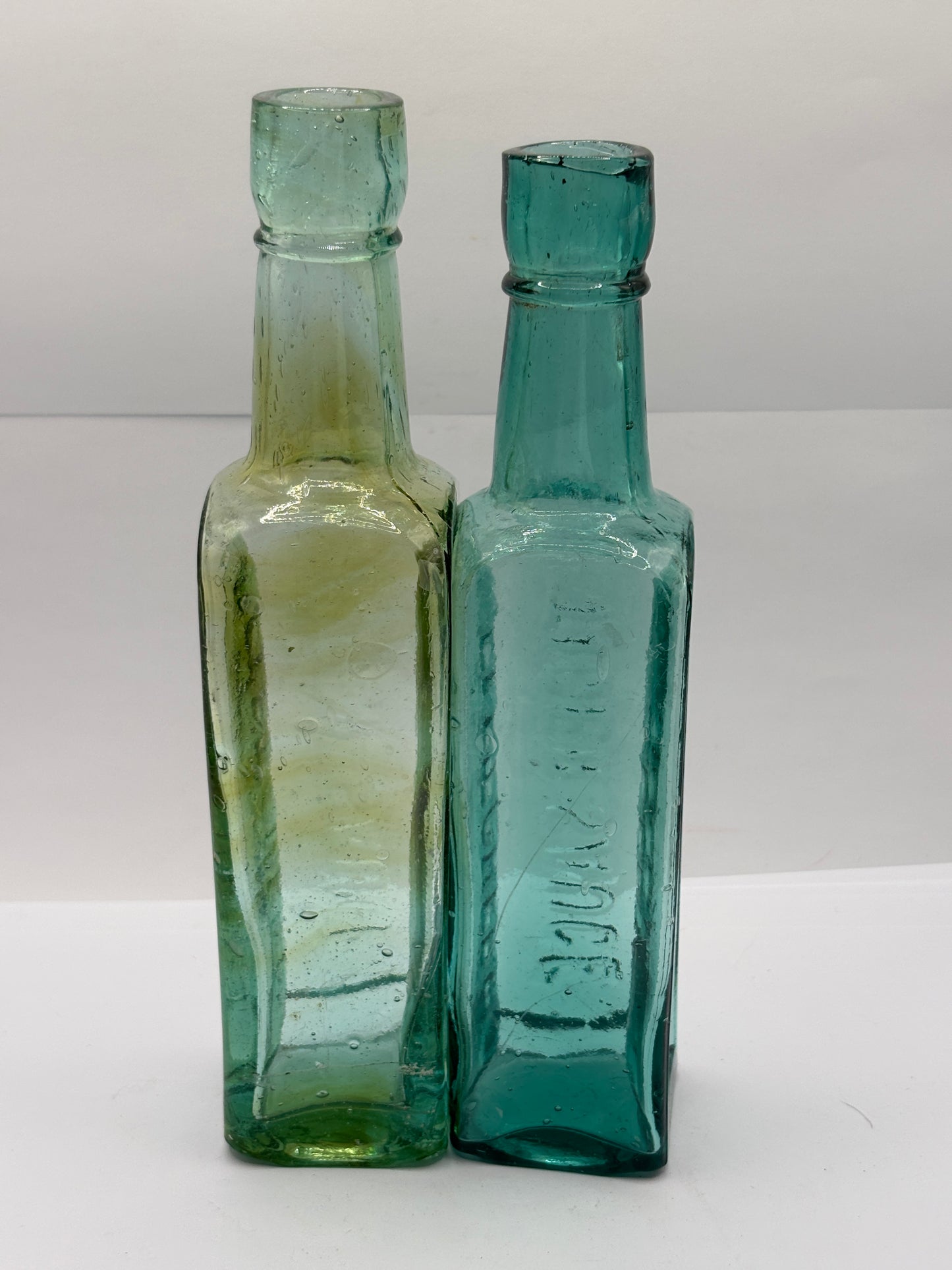 2 old aqua glass sauce bottles, Fletcher’s tiger sauce