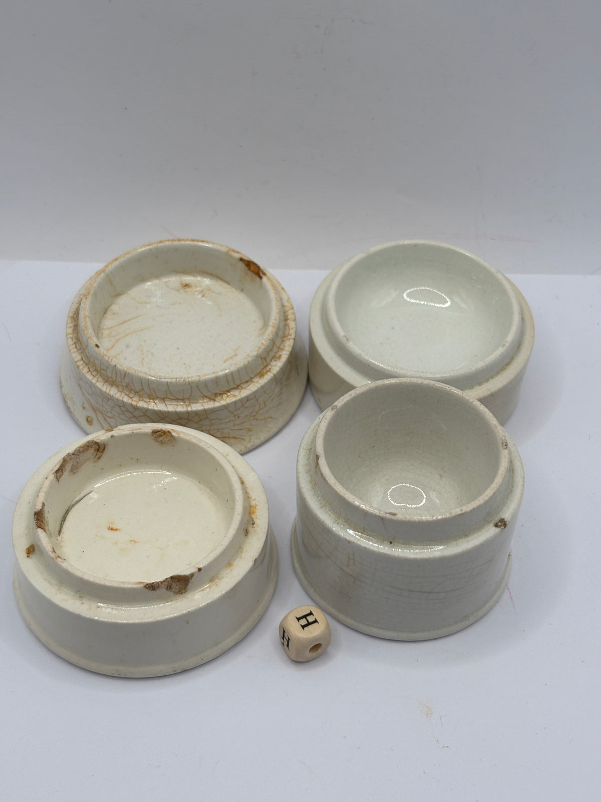 4 old stoneware pot lid bases, stackers (H)