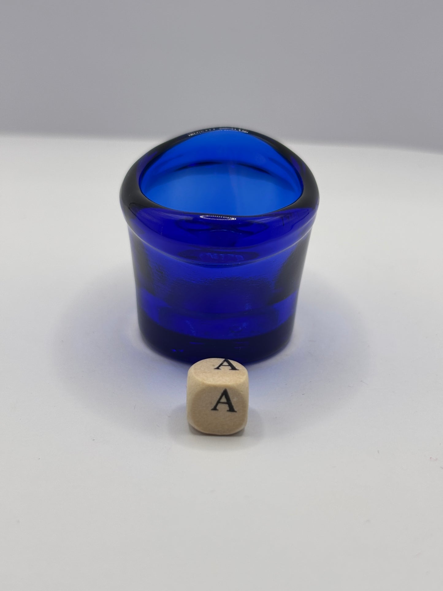 Old blue glass eye bath (a)