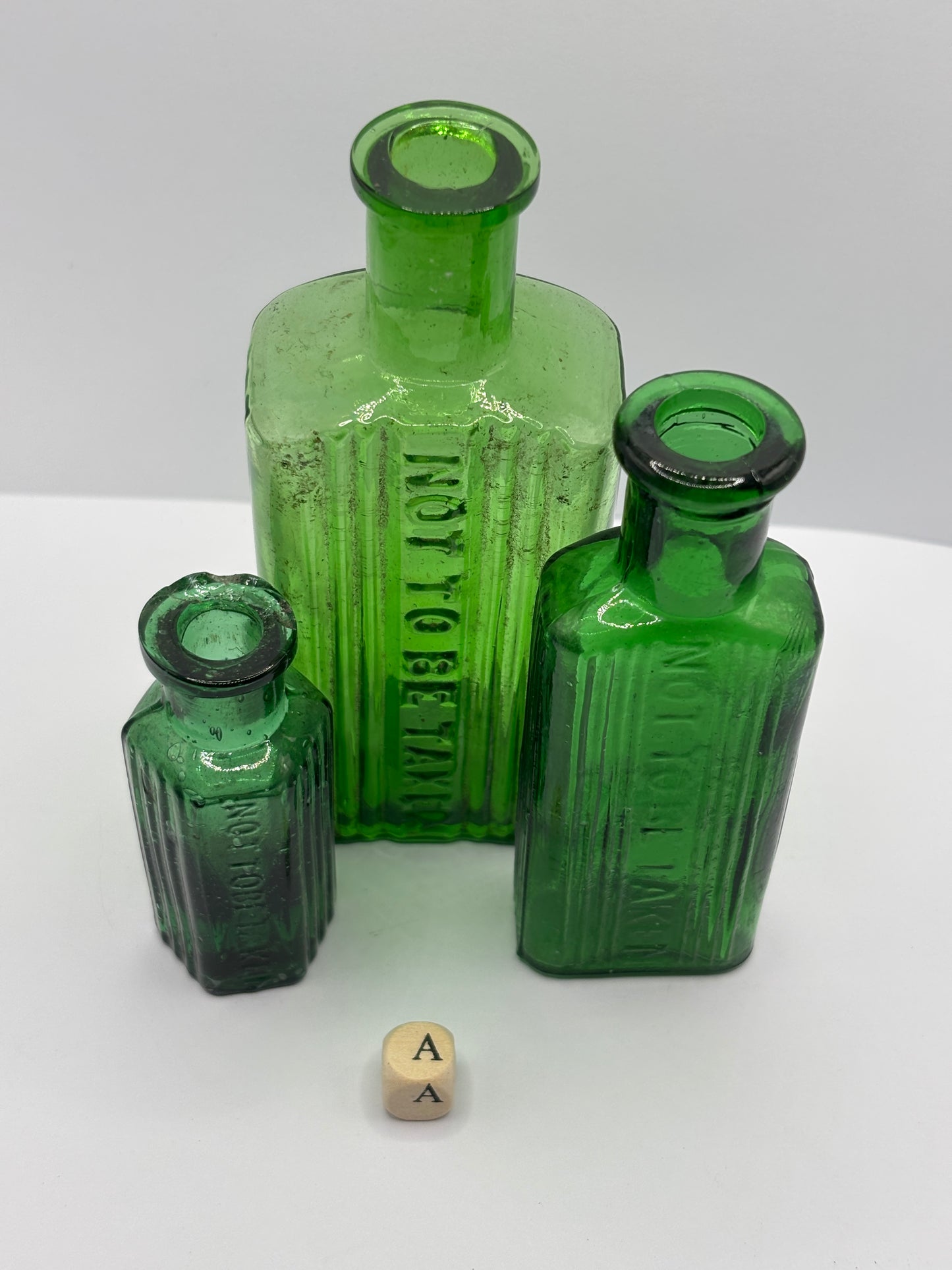 3 old green poison bottles, not to be taken