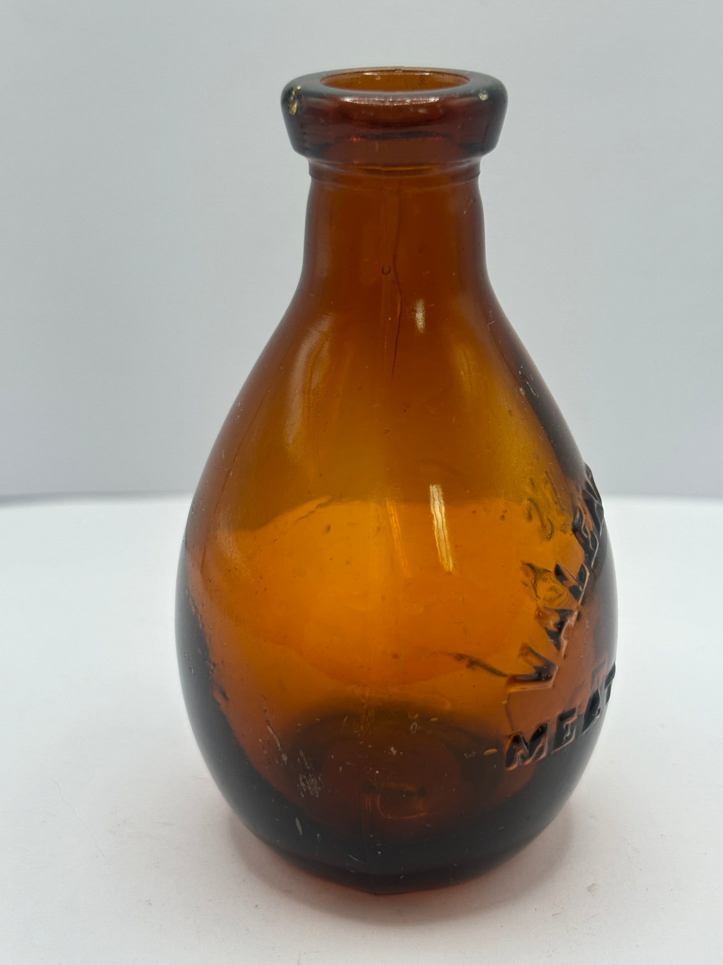 Small old amber glass valentines meat juices bottle