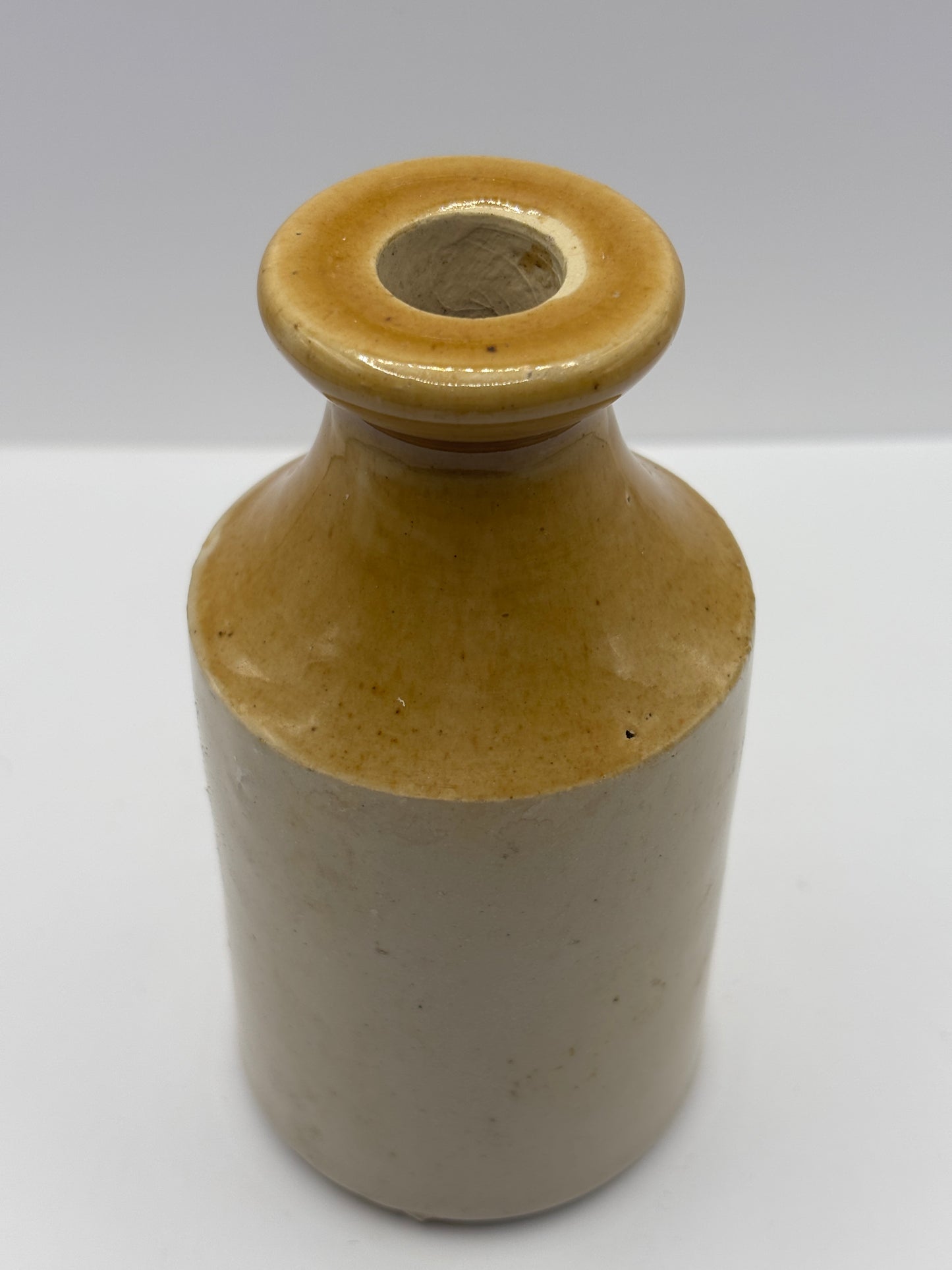 Old brown top stoneware pot, small vase