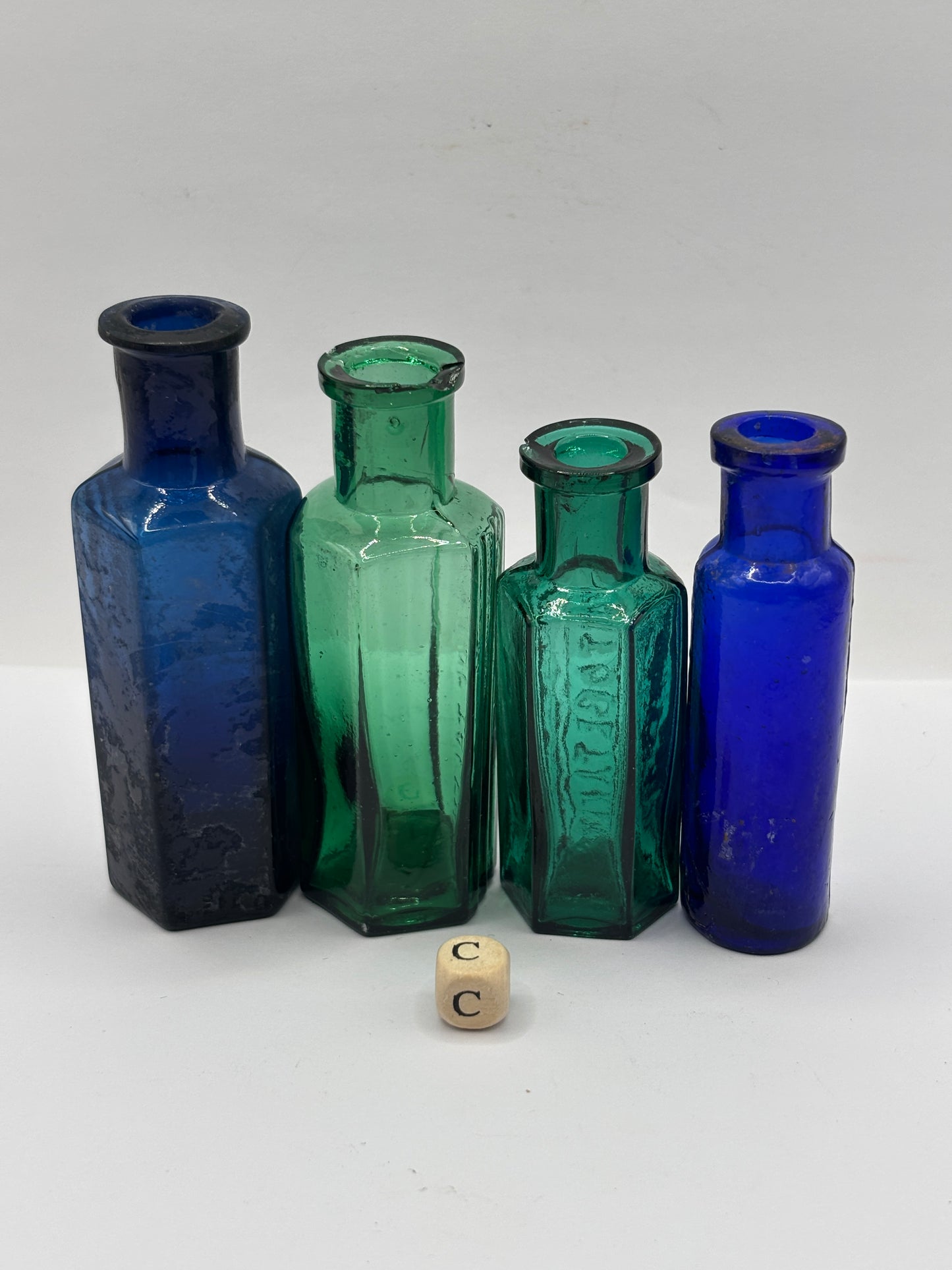 4 old glass poison bottles, chipped (C)