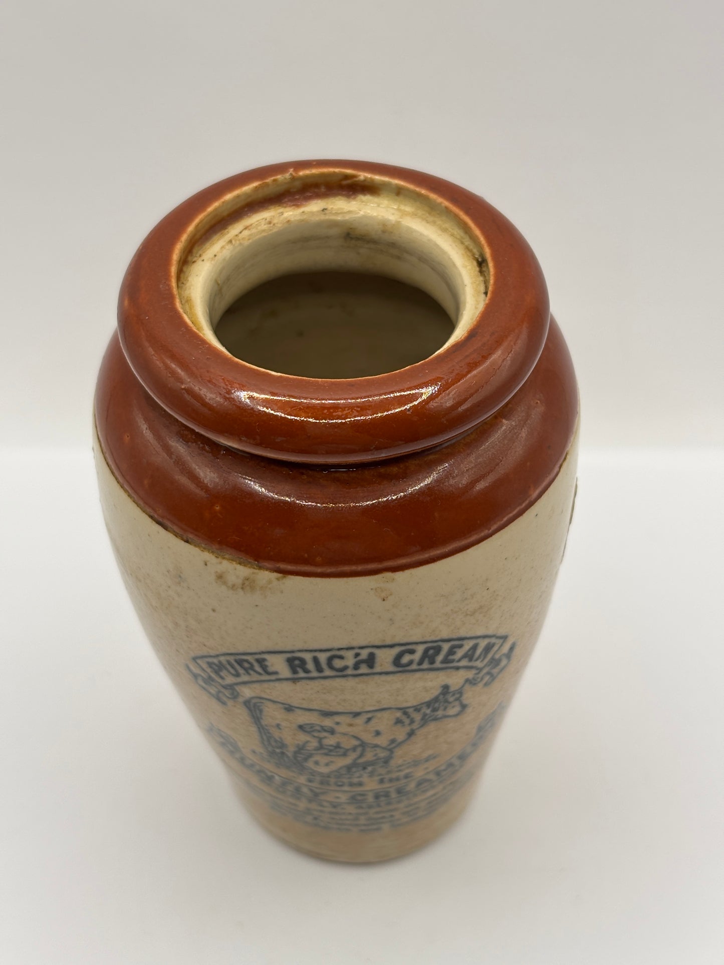 Old advertising cream pot, Huntly creamery. Milk maid. Pure rich cream