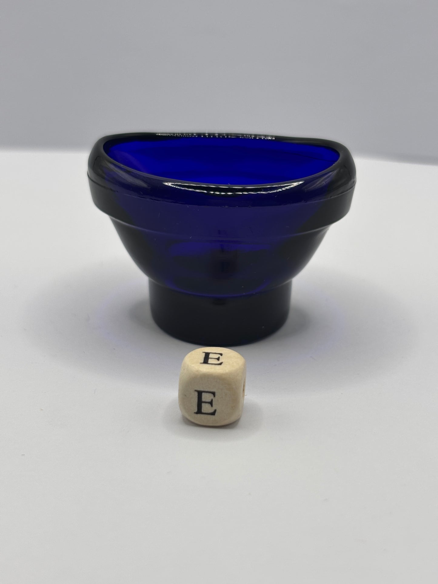 Old blue glass eye bath (e)