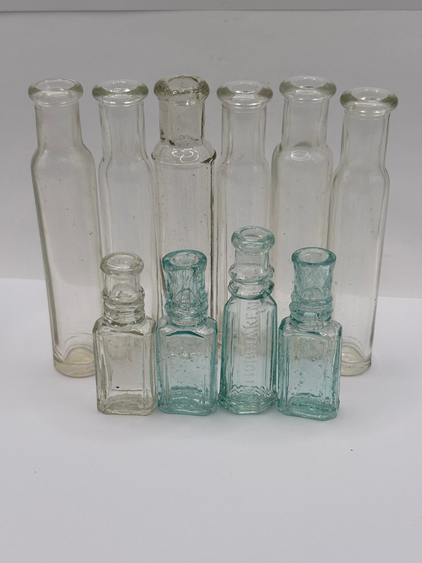 9 old glass bottles, vials, chemist bottles