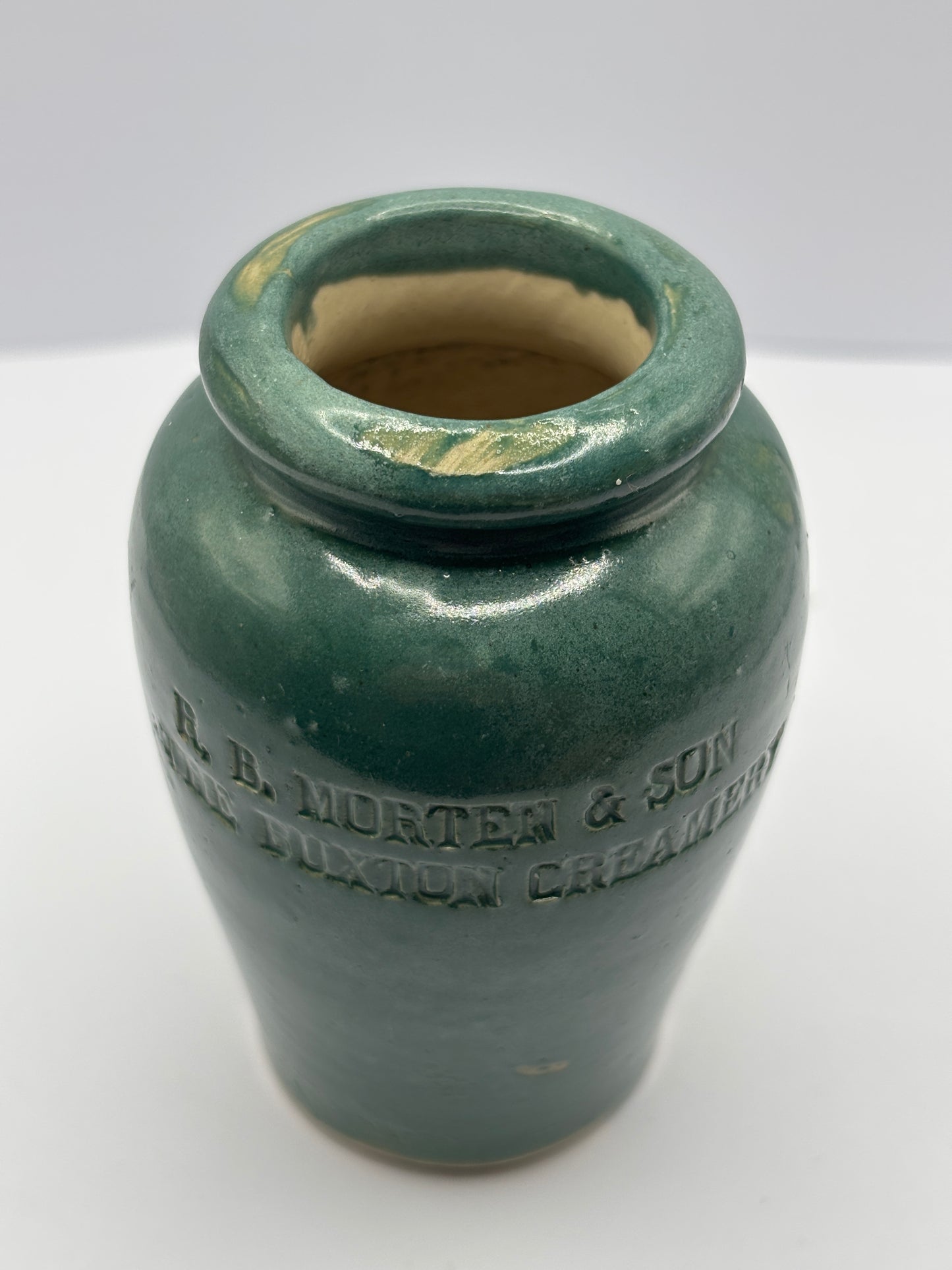 Old green stoneware cream pot. The Buxton creamery, R.B Morten & son