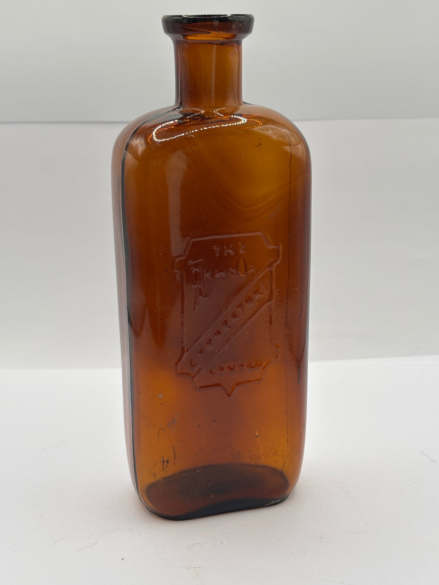 Old amber glass chemist bottle