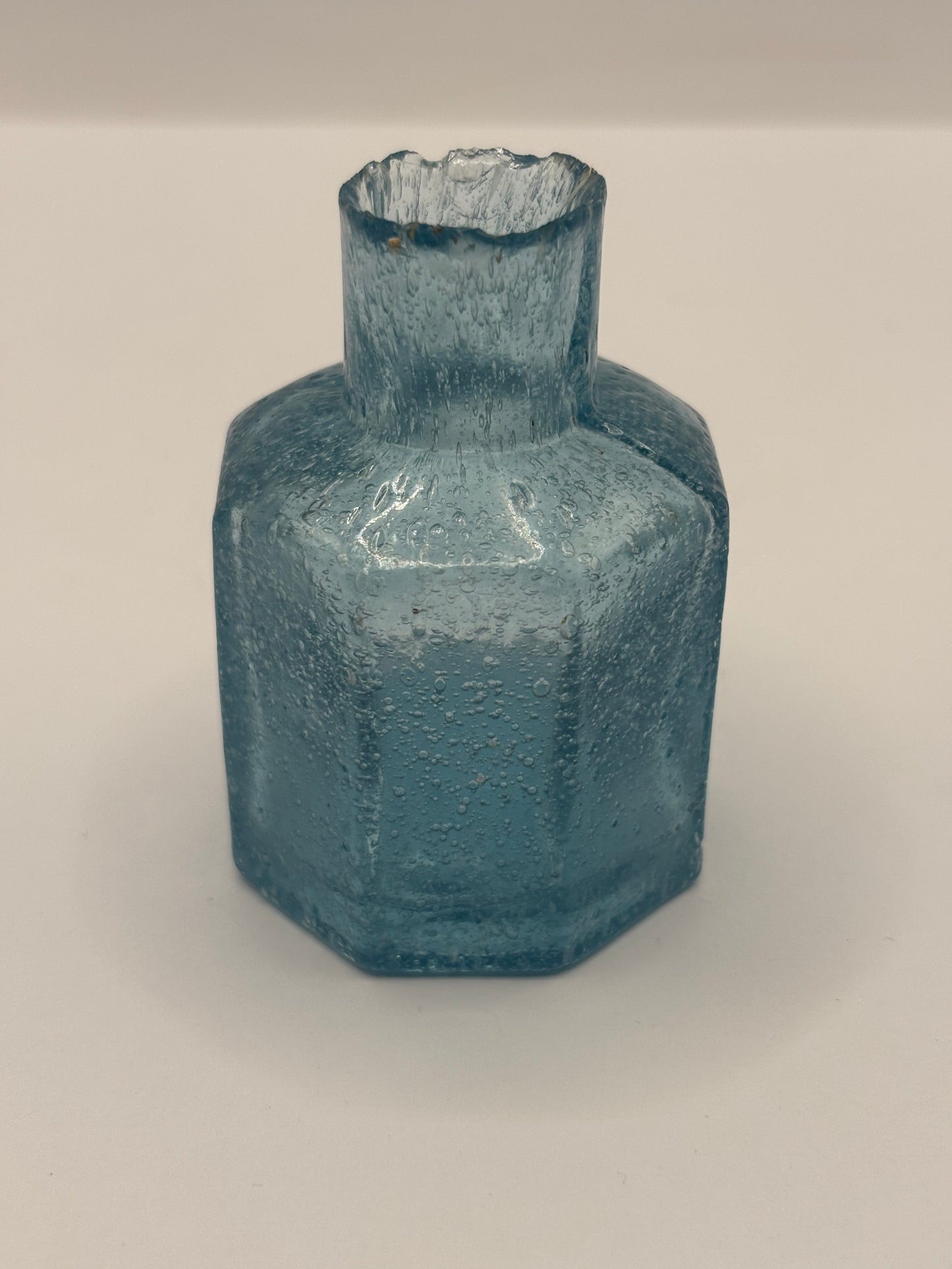 Old blue glass inkwell, ink bottle, penny ink. Lots of air bubbles