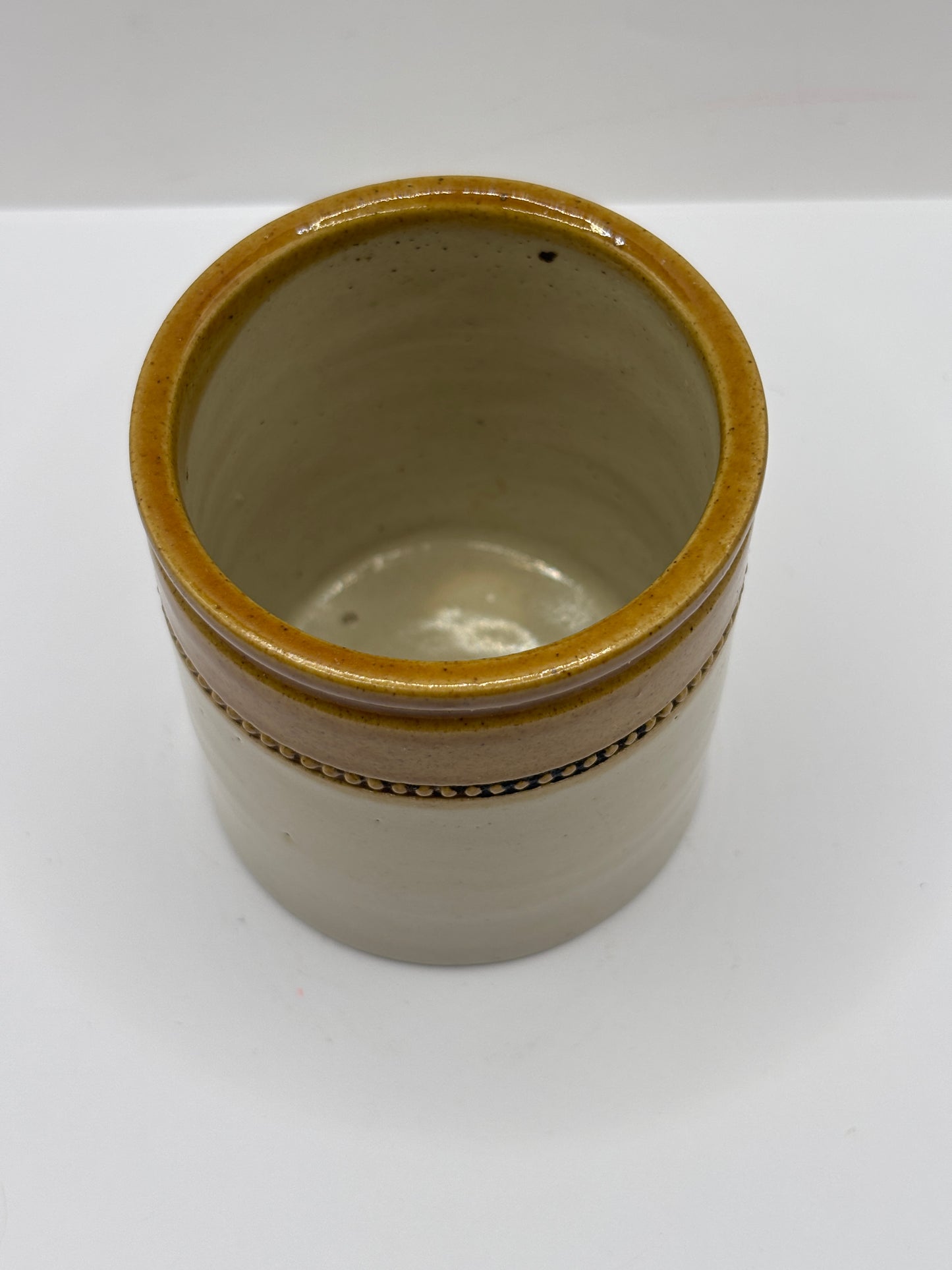 Old small brown top stoneware jar