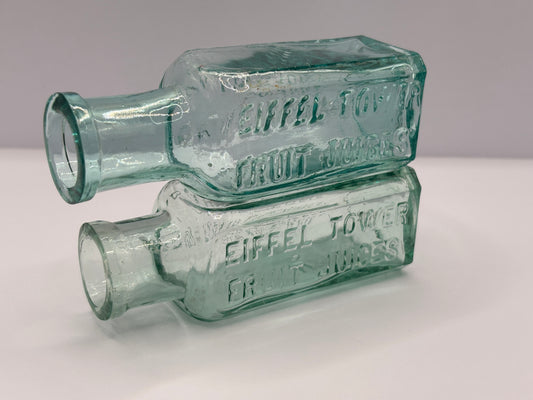 2 old aqua glass Eiffel tower fruit juices bottles