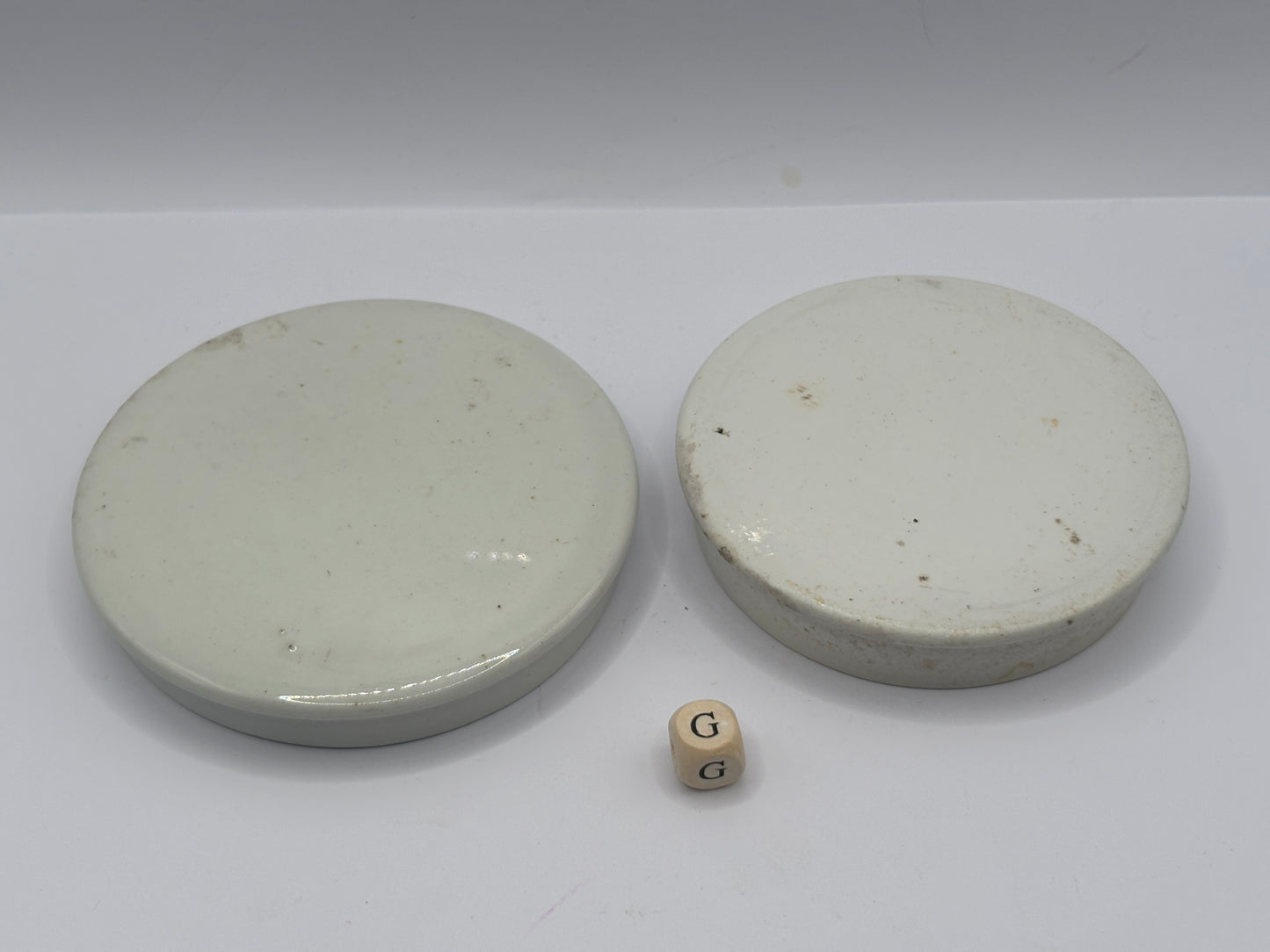 2 old plain stoneware lids (G)