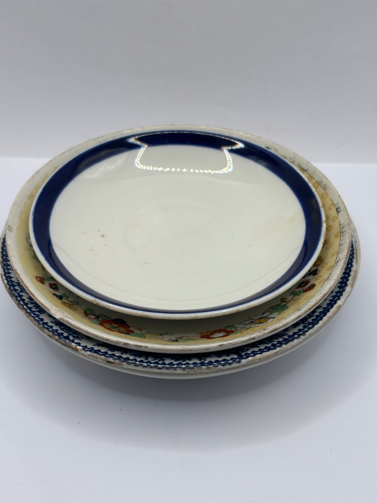 4 old decorative saucers (all dump dug)
