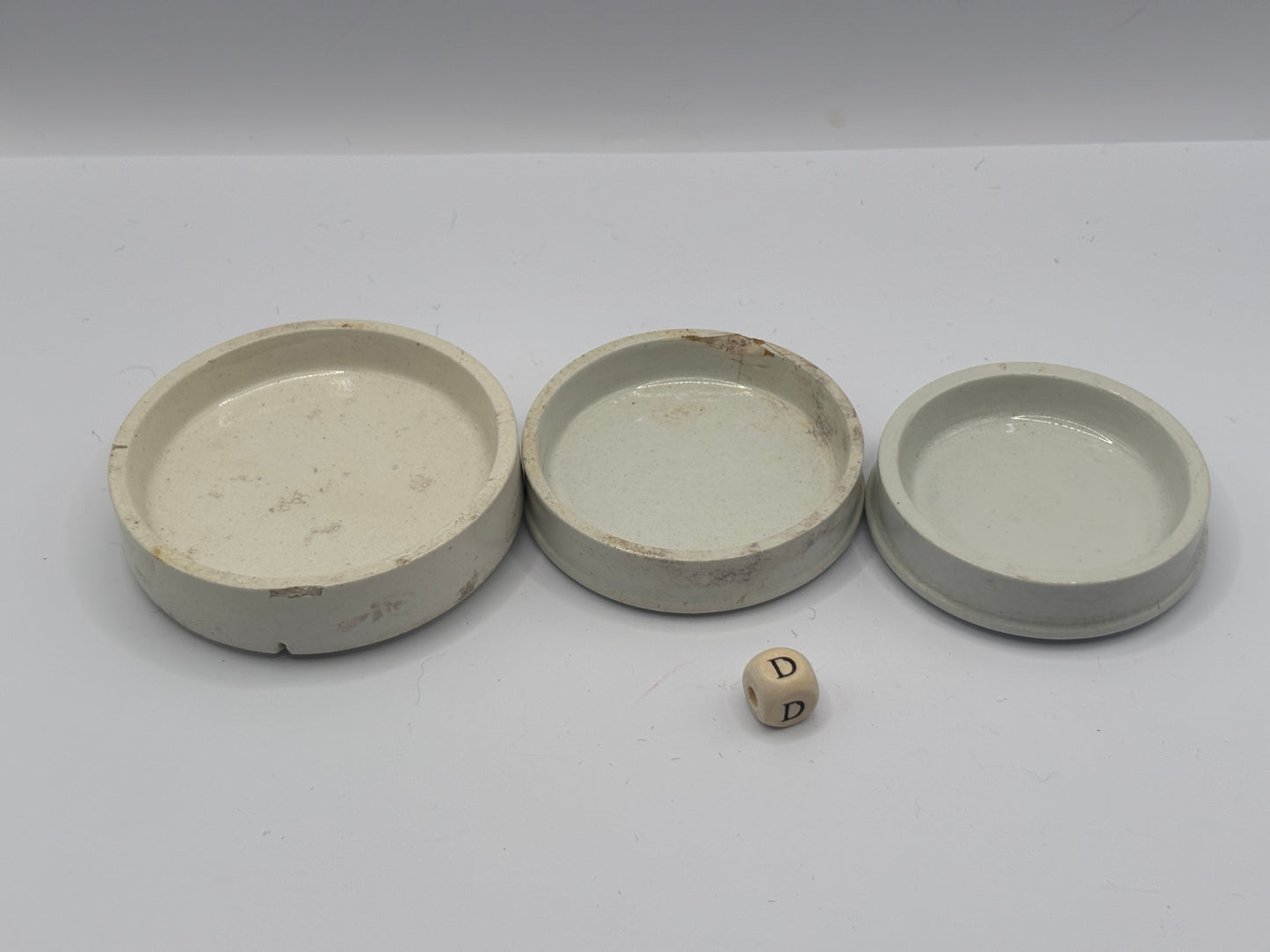 3 old plain stoneware lids (D)