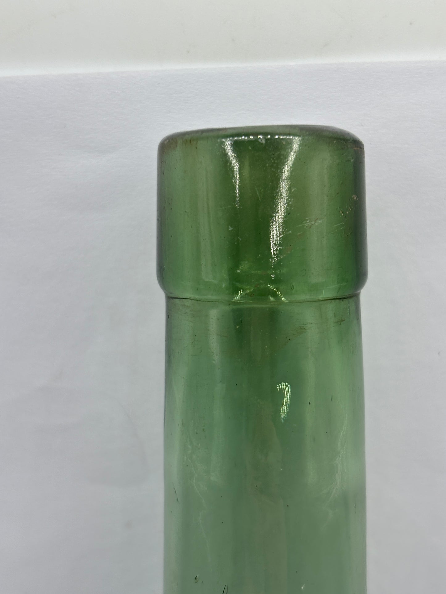 Old round bottom aqua glass bottle