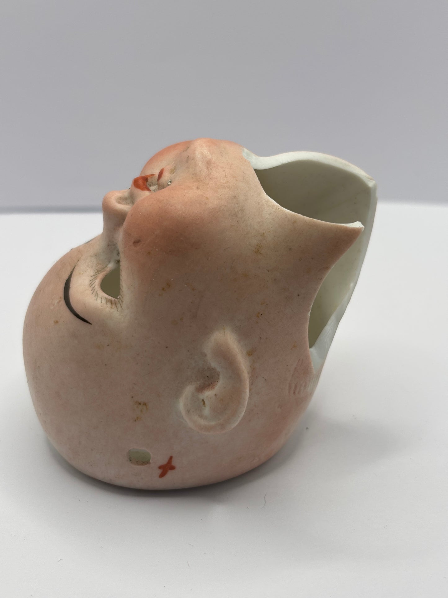 Old dolls head, damaged