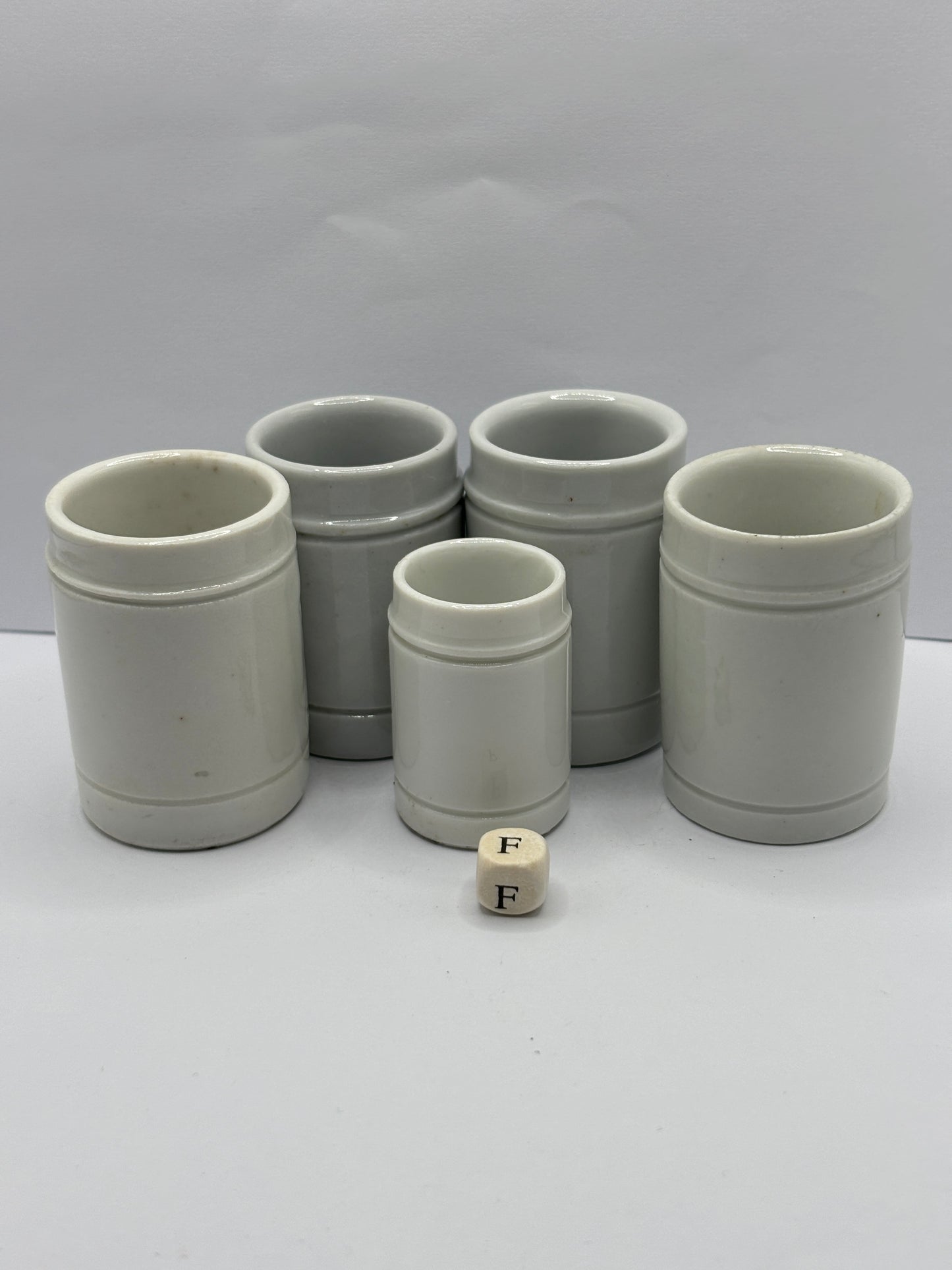 5 small white stoneware pots (F)