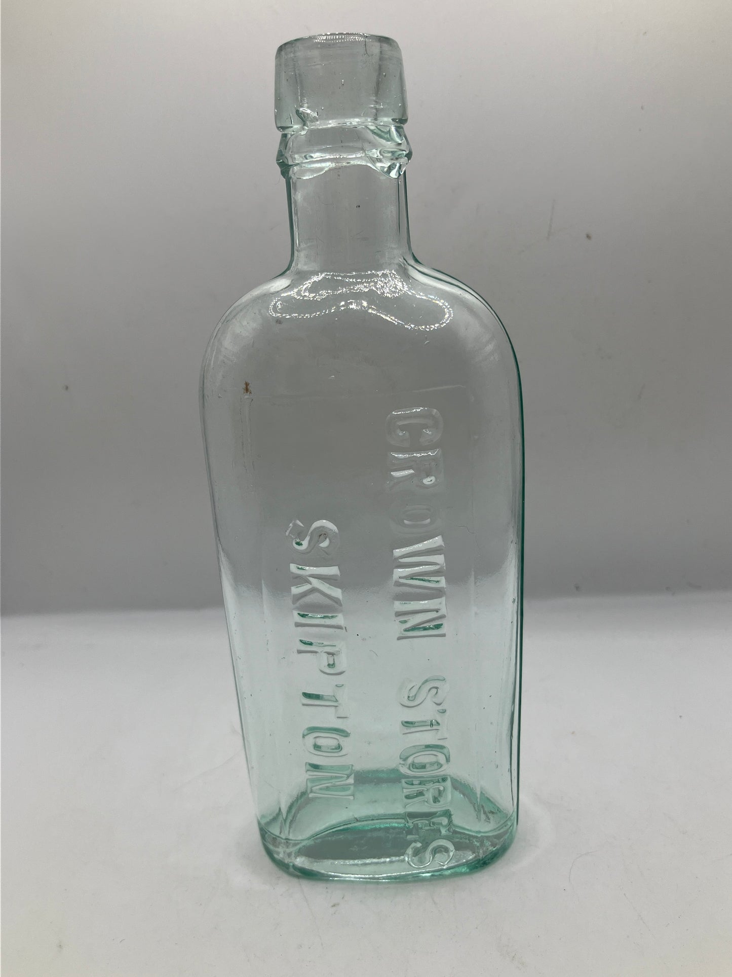 Aqua glass advertising spirit flask, Skipton