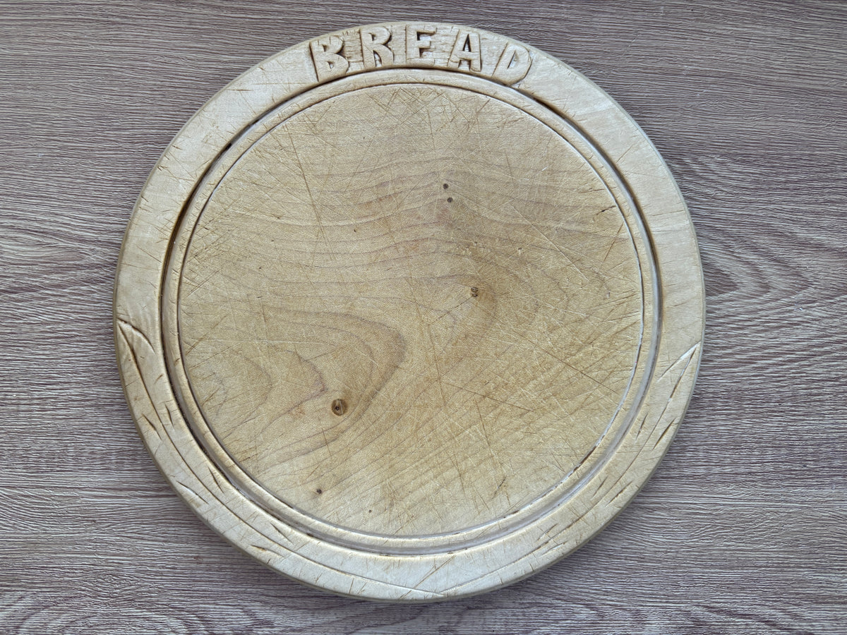 Old wooden carved bread board