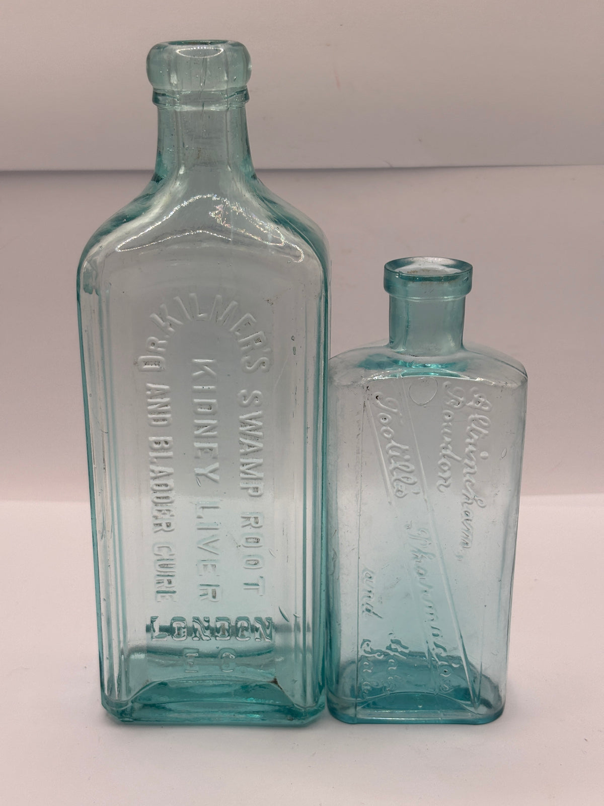 2 old  advertising chemist bottles
