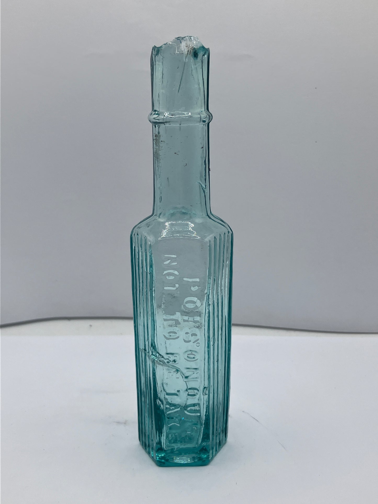 Tall slim poison bottle, poisonous not to be taken