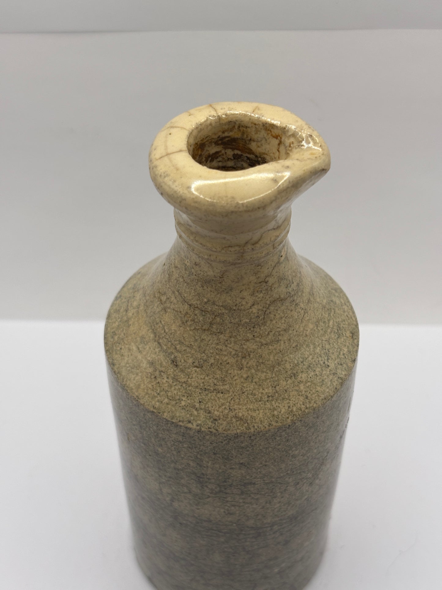 Old white stoneware pouring ink