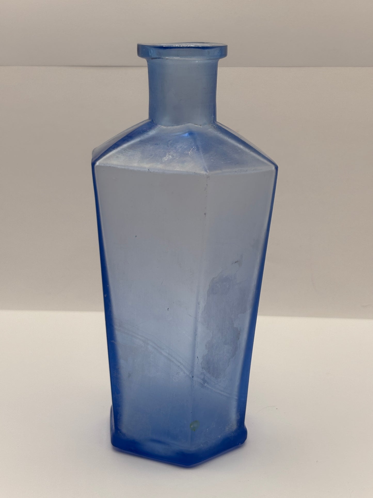 Old unusual blue glass bottle. 6 sided