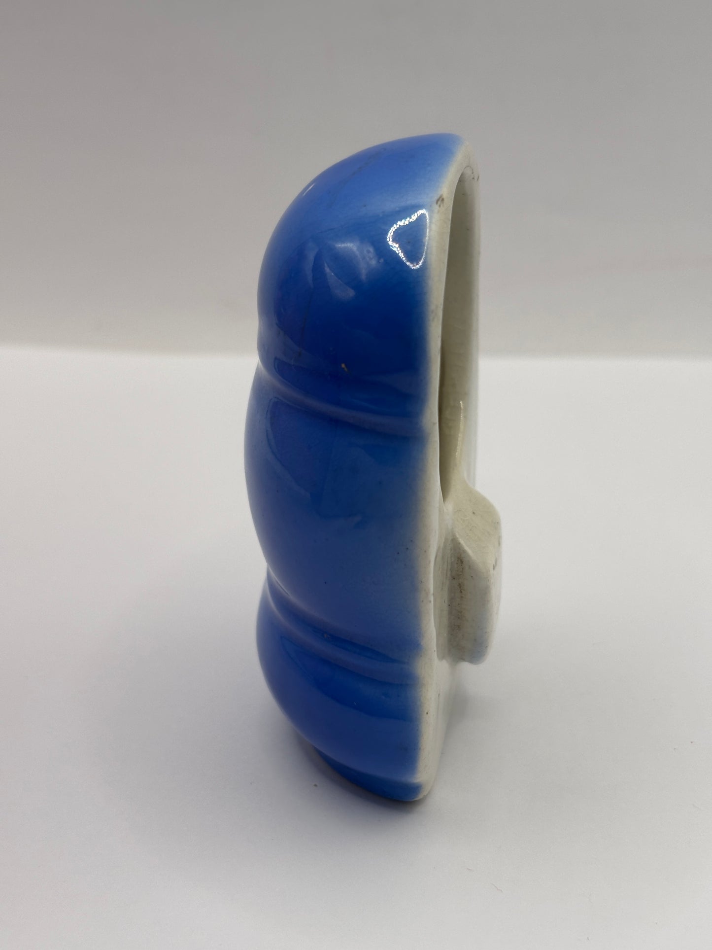 Old blue ceramic bird feeder