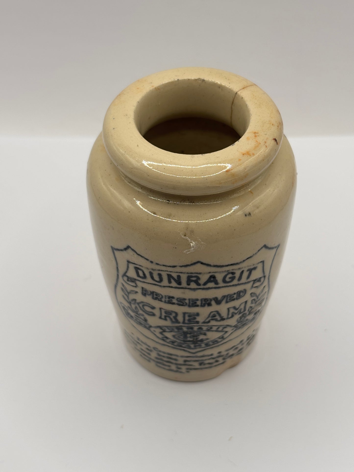 Old advertising cream pot, Dunragit preserved cream. Damaged