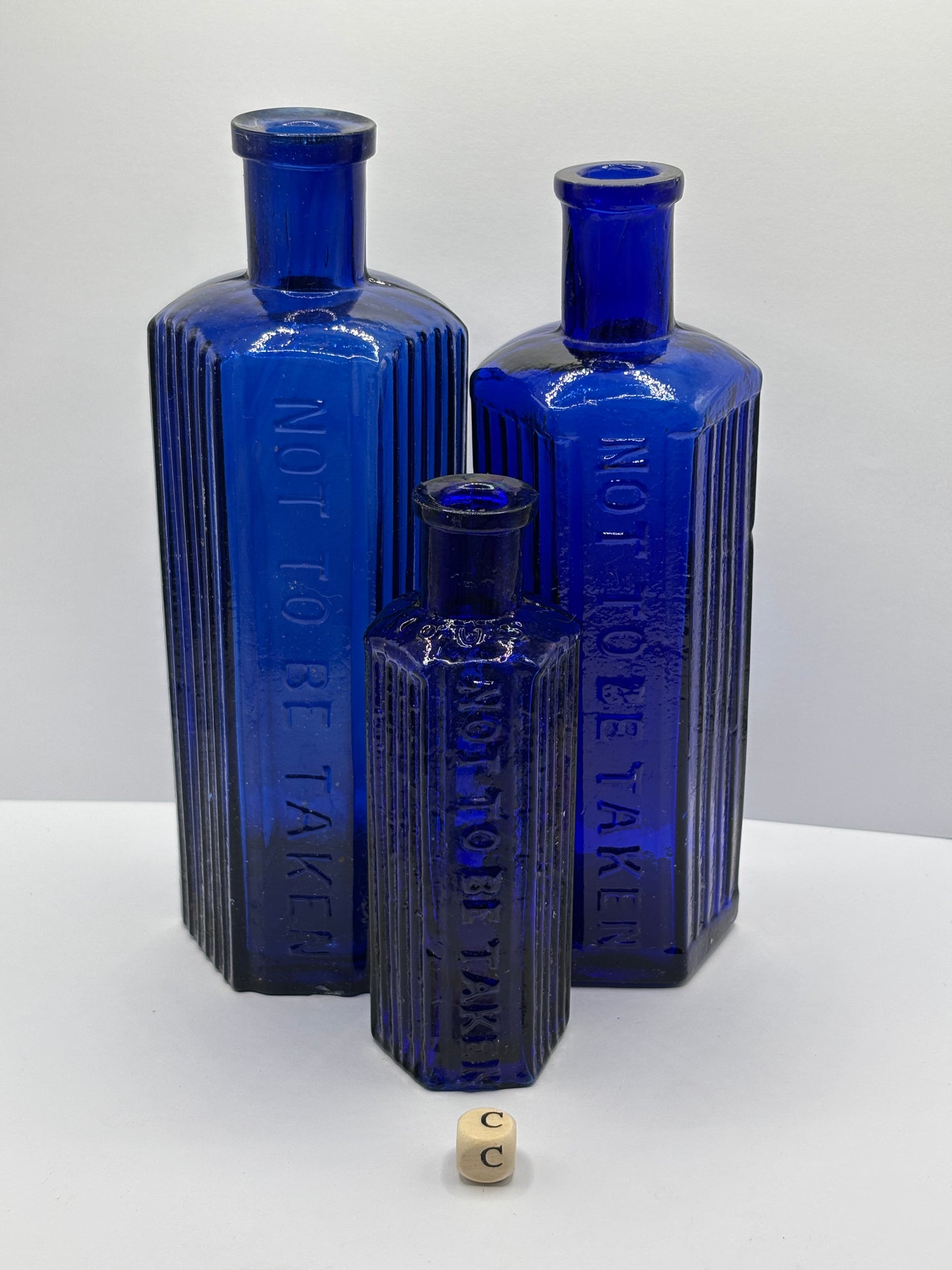 3 old blue poison bottles, not to be taken