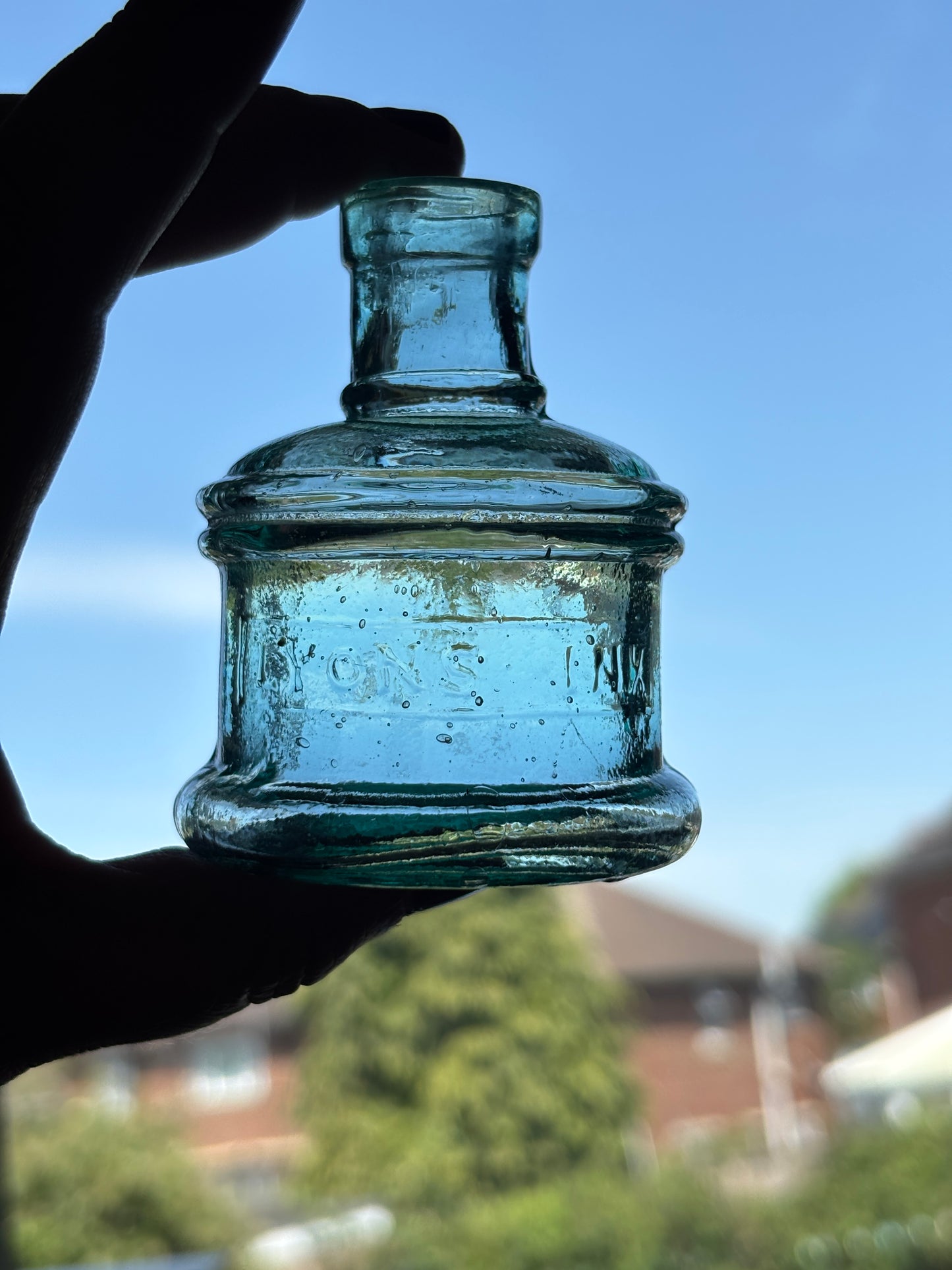 Old aqua glass advertising inkwell, ink bottle. Lyons ink