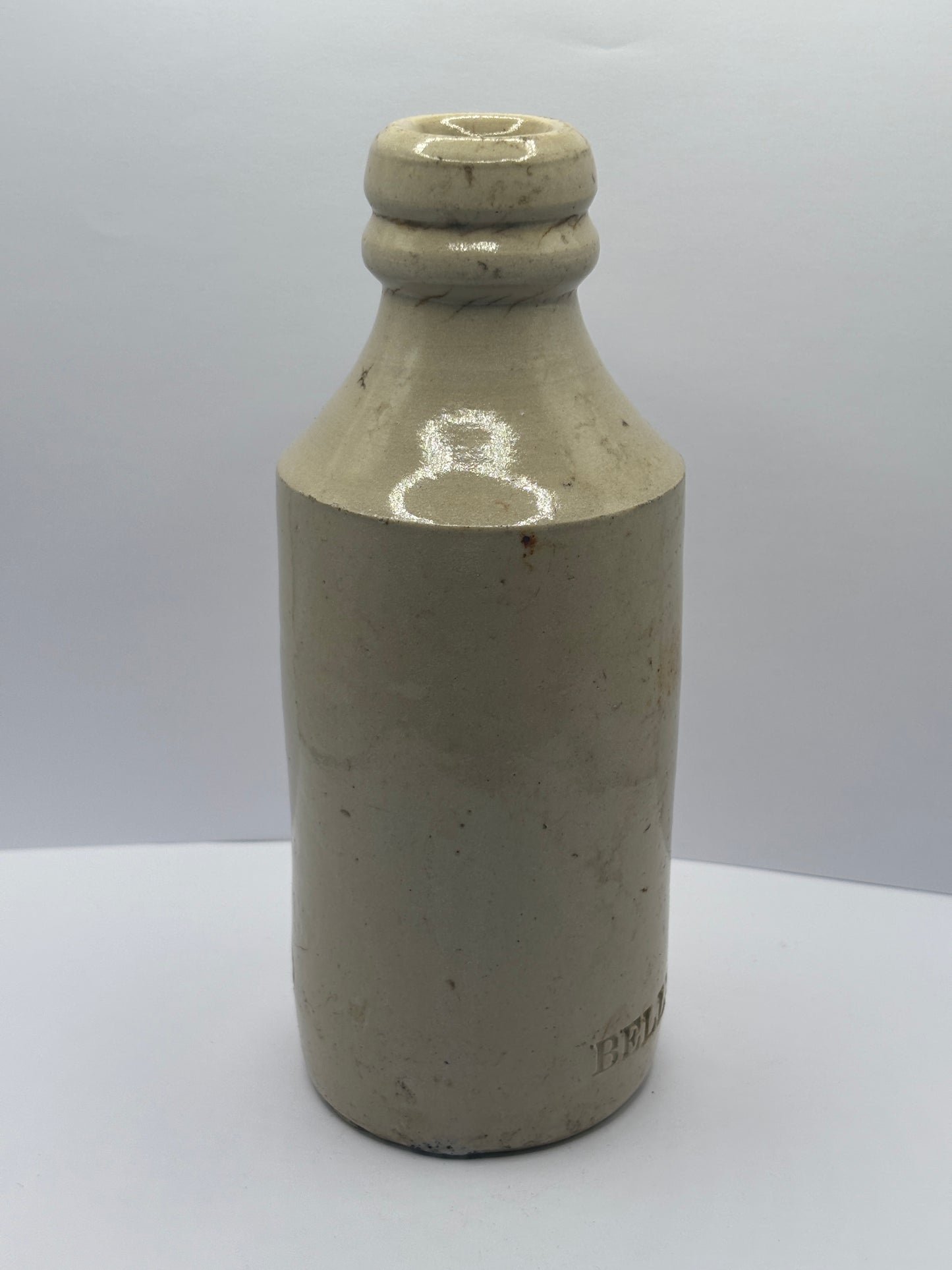 Old white stoneware Belle vue ginger beer bottle