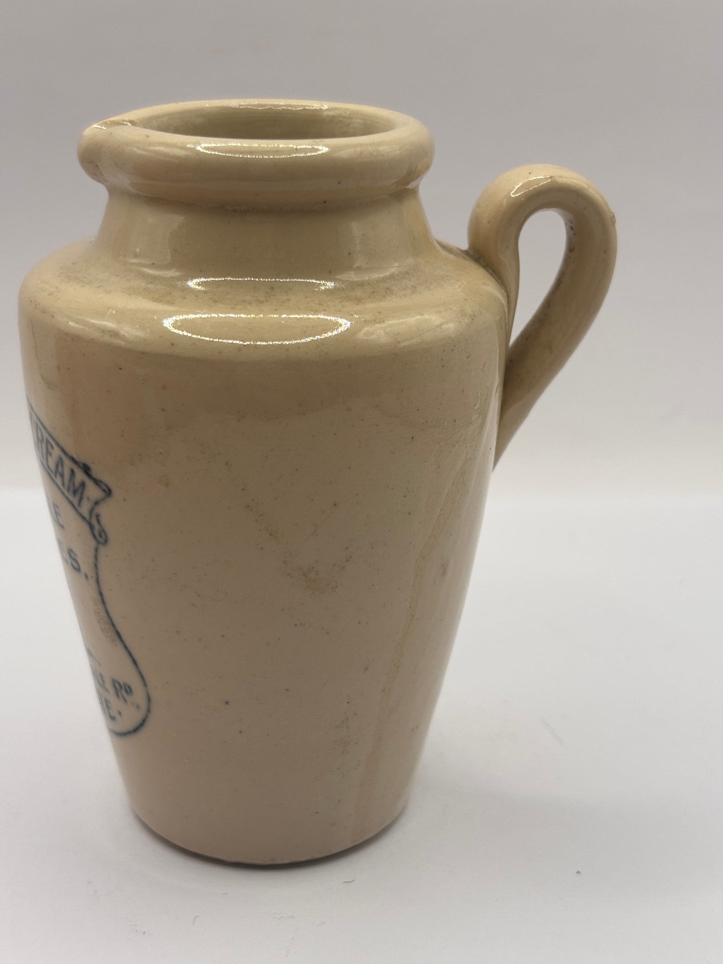 Old advertising cream pot, Nidderdale creameries. Pure fresh cream. Cow print
