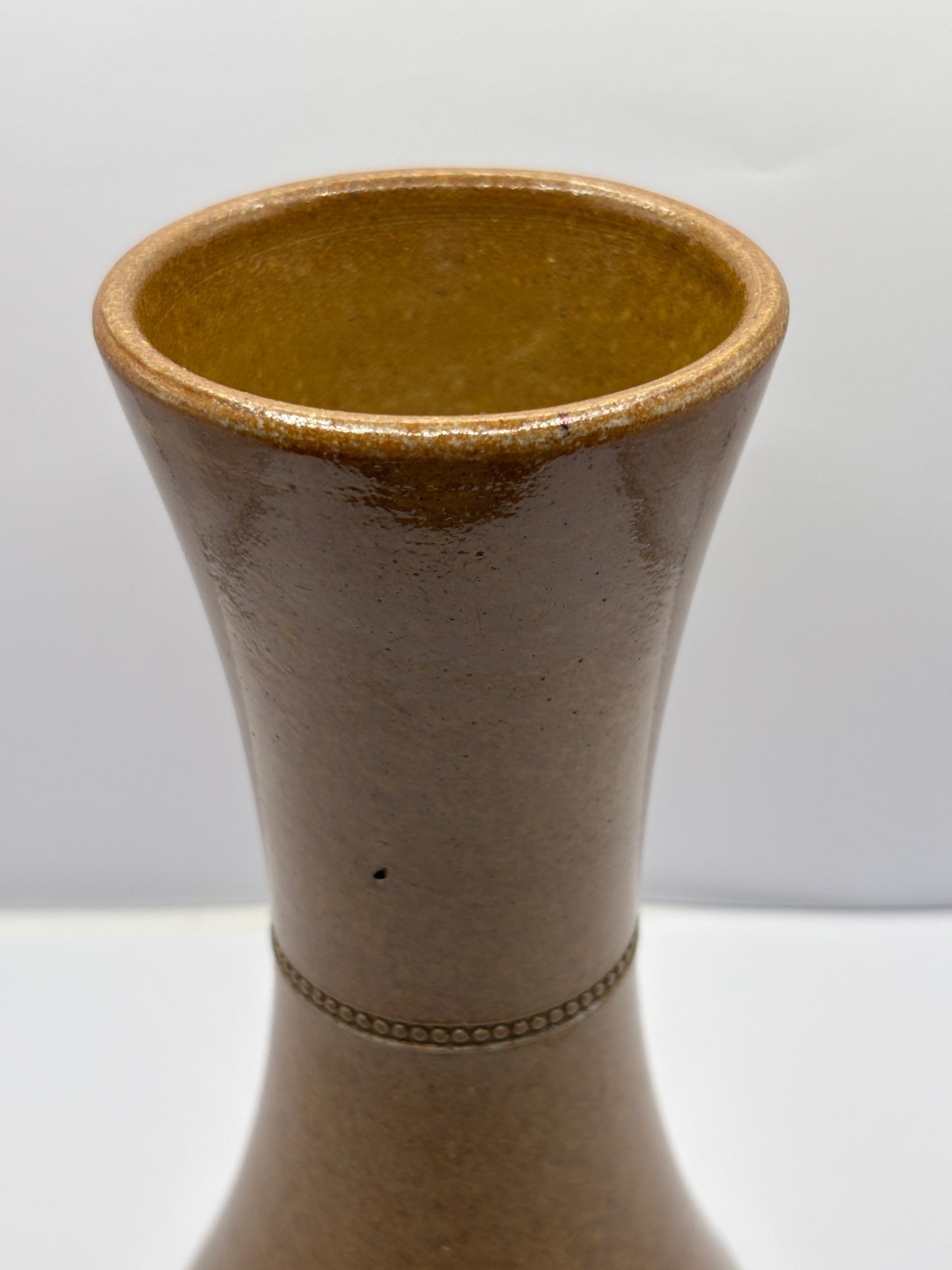 Old brown stoneware vase