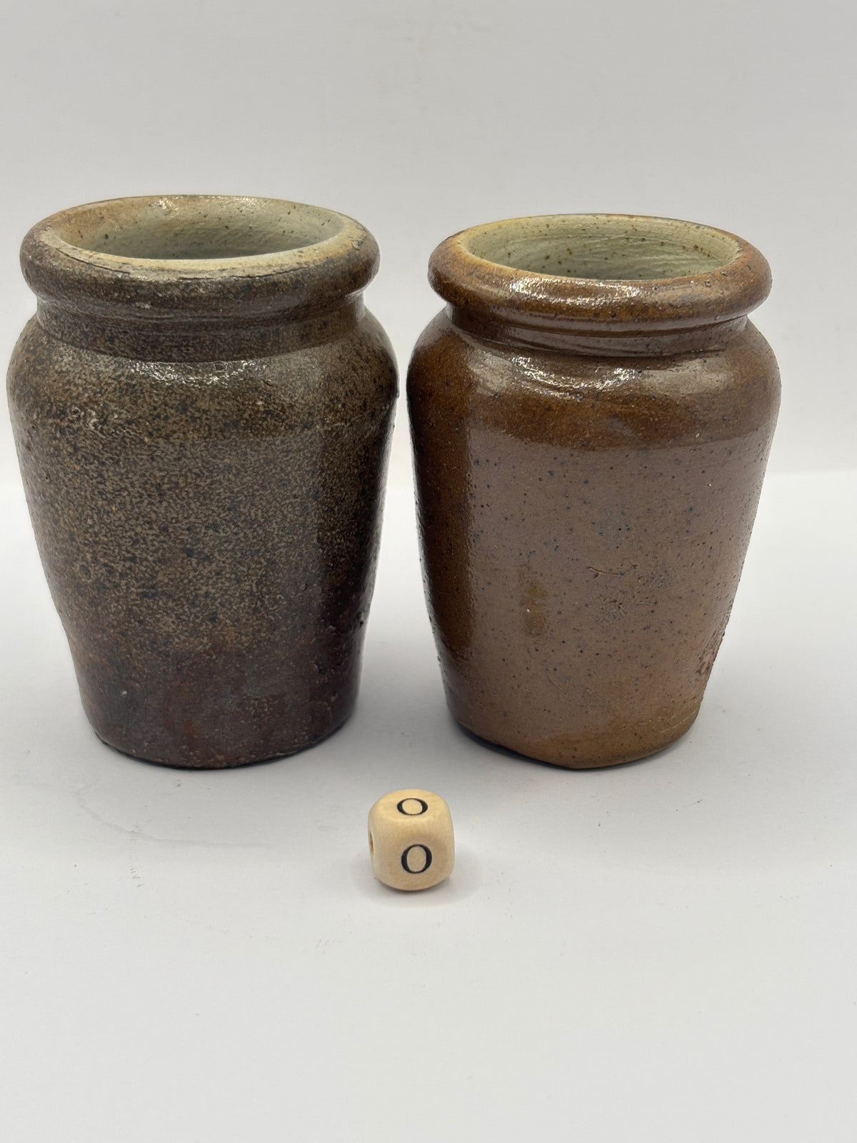 2 Old brown stoneware cream pots (o)
