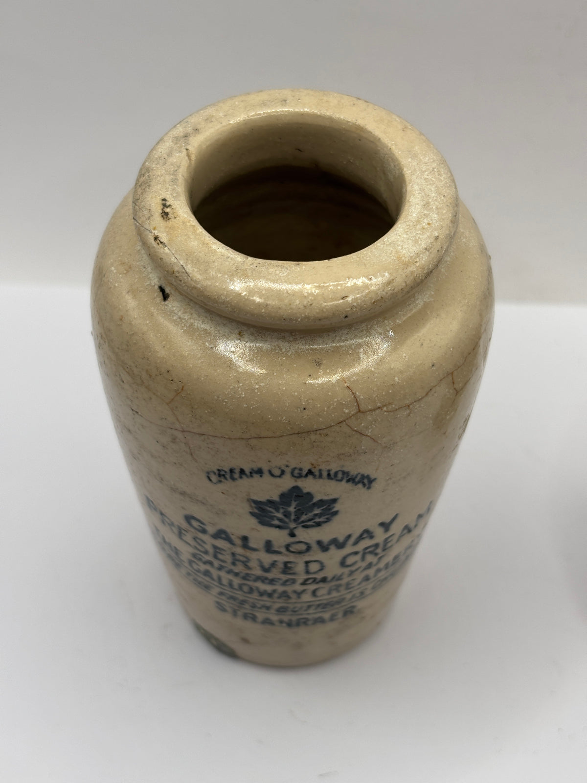 Old advertising cream pot, Galloway creamery Stranraer. Filled in chip