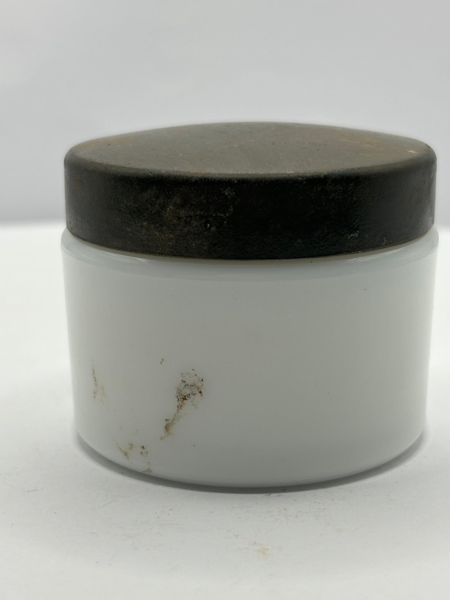 Small milk glass jar with original lid