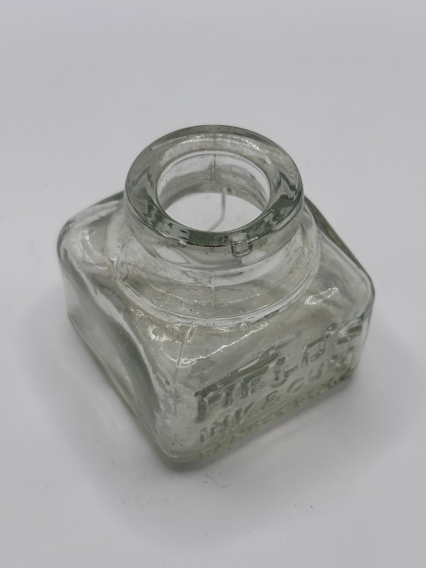 Old clear glass ink bottle, inkwell. fields ink & gum