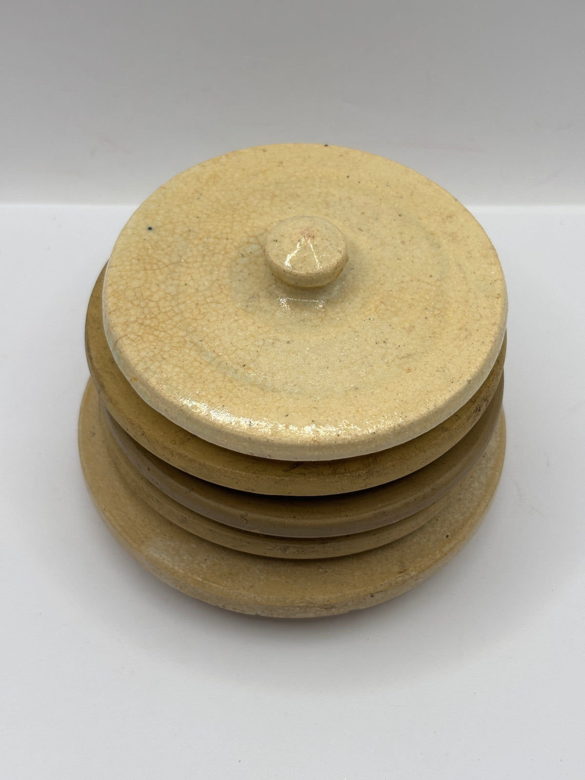 5 old stoneware lids, stackers
