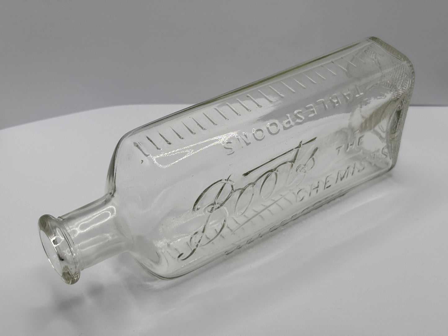 Old clear glass Boots chemist bottle