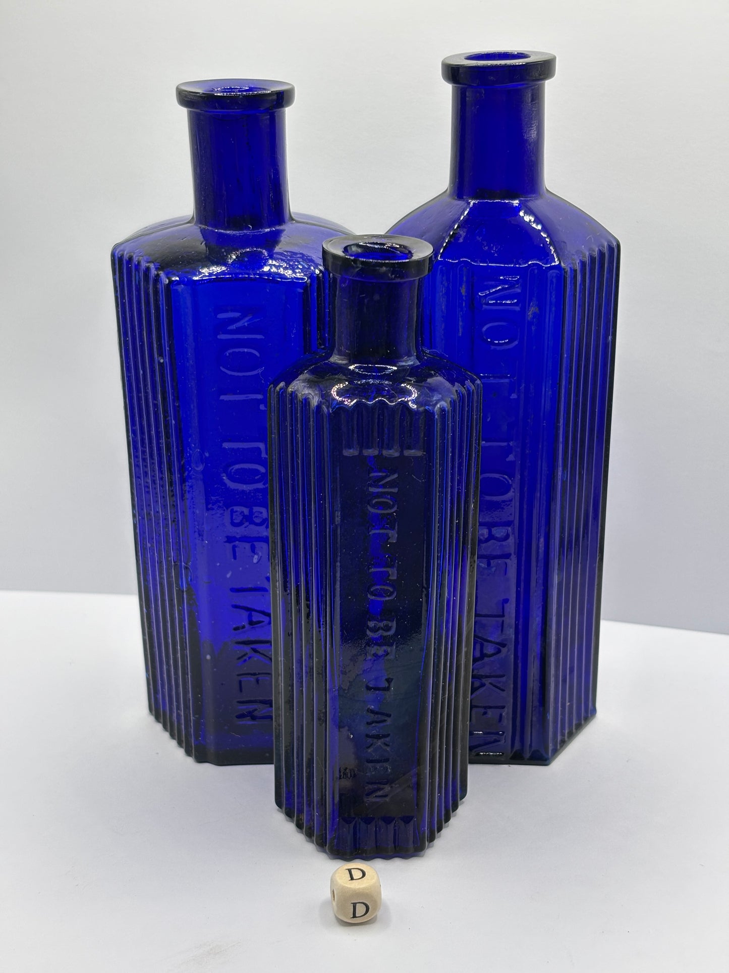 3 old blue poison bottles, not to be taken