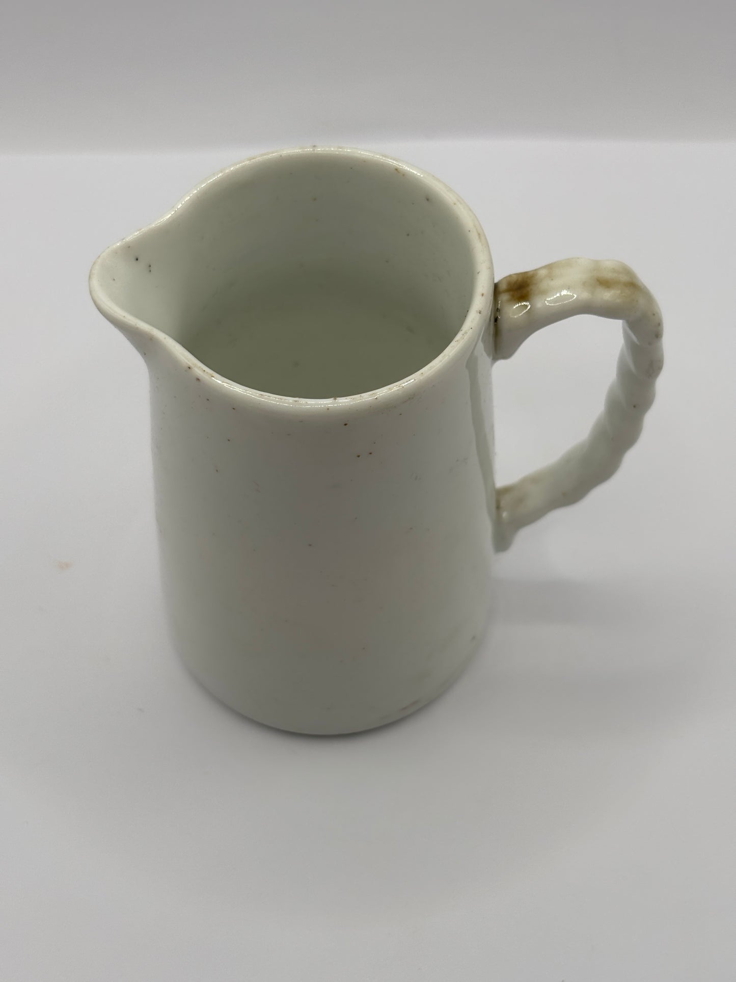 Old small white jug. 8cms